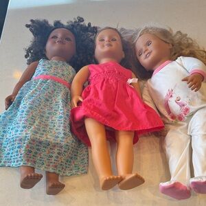 Charming Doll Trio with Colorful Outfits